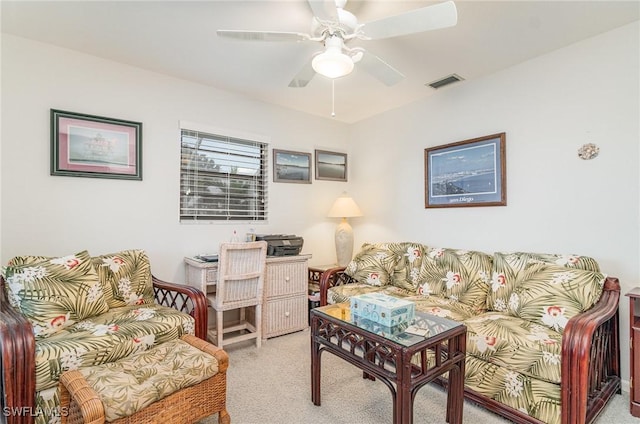 carpeted living area with ceiling fan and visible vents