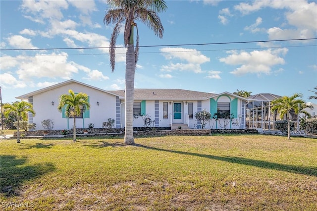 view of front facade featuring stucco siding and a front yard