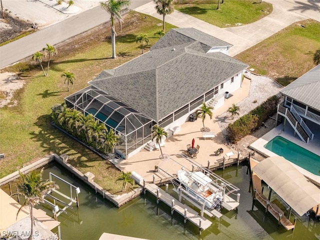 drone / aerial view with a water view