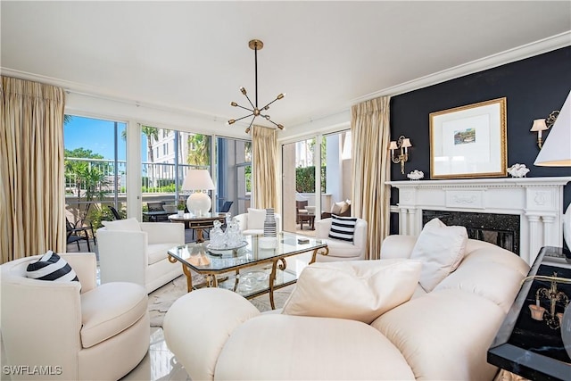 living area featuring a fireplace and an inviting chandelier