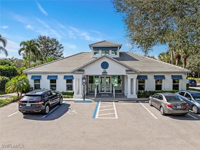 view of property featuring uncovered parking