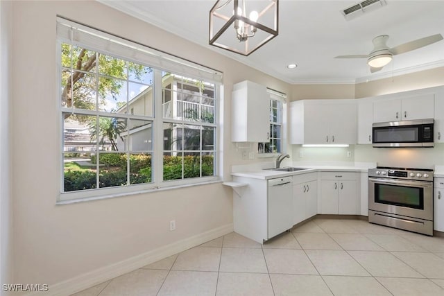 kitchen with light tile patterned floors, light countertops, visible vents, appliances with stainless steel finishes, and a sink