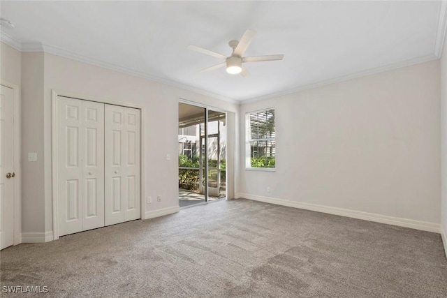 unfurnished bedroom with access to outside, ornamental molding, and carpet floors