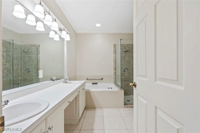 full bath with tile patterned flooring, a sink, a shower stall, and a bath