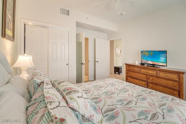 bedroom featuring a closet, visible vents, and ceiling fan