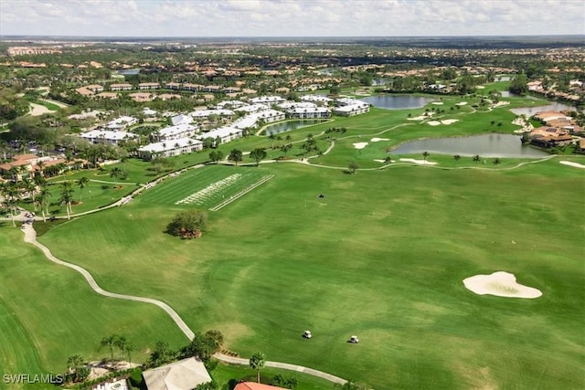 bird's eye view featuring view of golf course and a water view