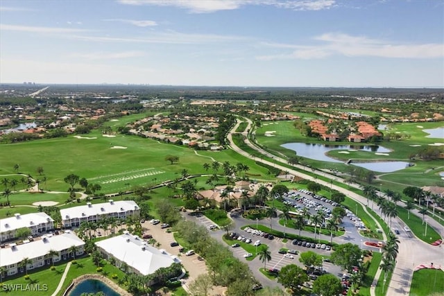 bird's eye view with a water view and golf course view