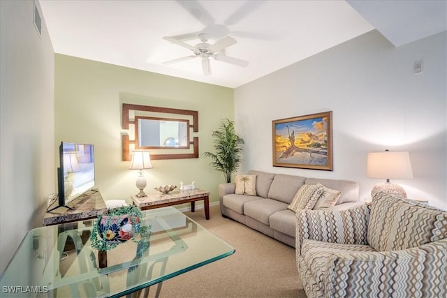 carpeted living area with a ceiling fan, visible vents, and baseboards