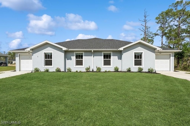 single story home with concrete driveway, an attached garage, and a front yard