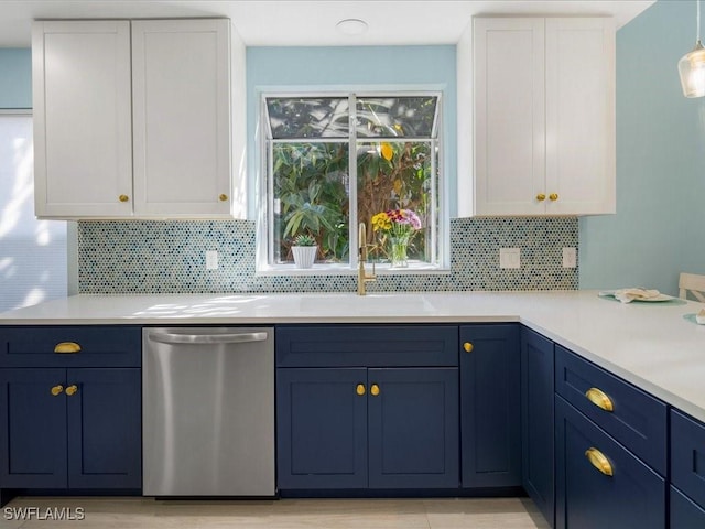 kitchen with light countertops, white cabinets, and stainless steel dishwasher