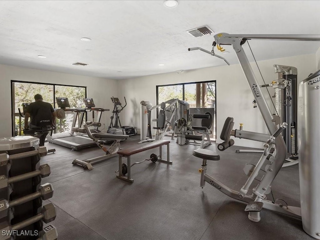 gym featuring recessed lighting and visible vents