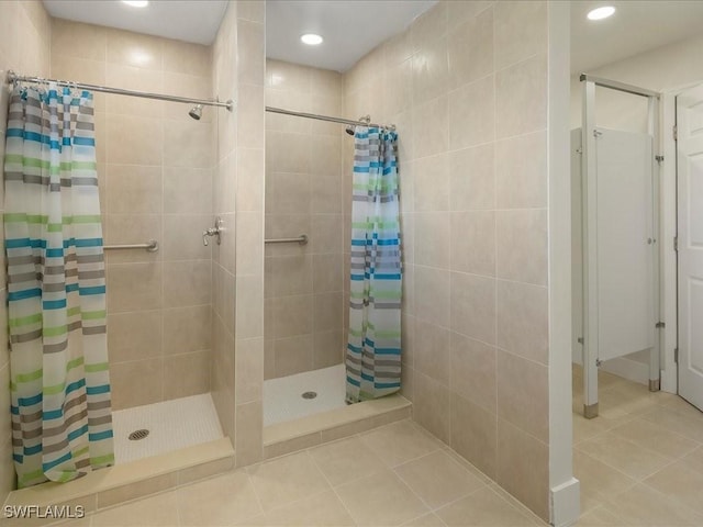 bathroom with a stall shower, tile patterned flooring, and recessed lighting