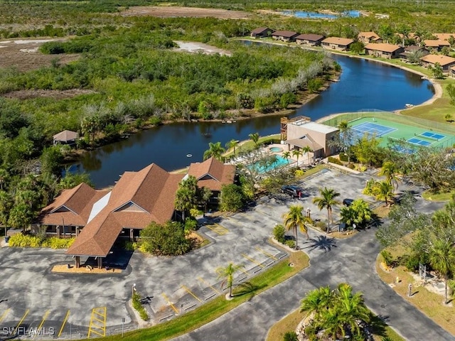 drone / aerial view featuring a water view and a residential view