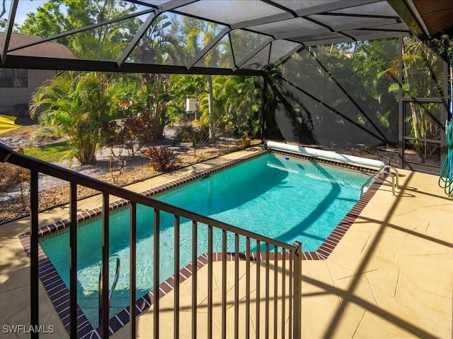 outdoor pool with a lanai and a patio