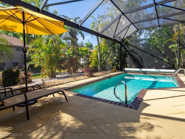 outdoor pool featuring glass enclosure and a patio area