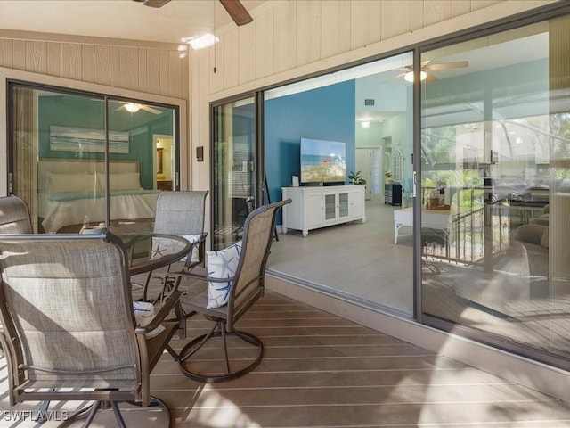 sunroom with a ceiling fan