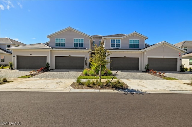 view of front of property featuring driveway and a garage