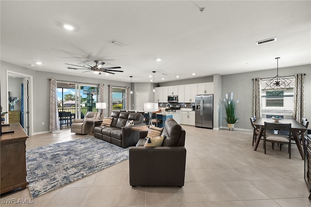 living room with visible vents, recessed lighting, baseboards, and ceiling fan