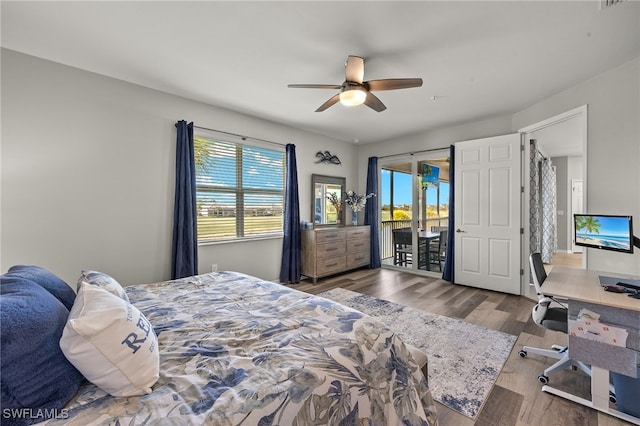 bedroom featuring wood finished floors, a ceiling fan, and access to outside