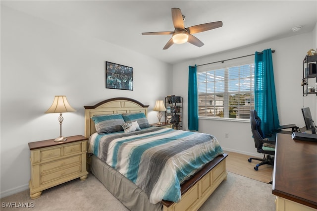 bedroom featuring baseboards and ceiling fan