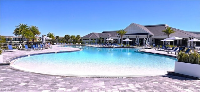 community pool with a patio area