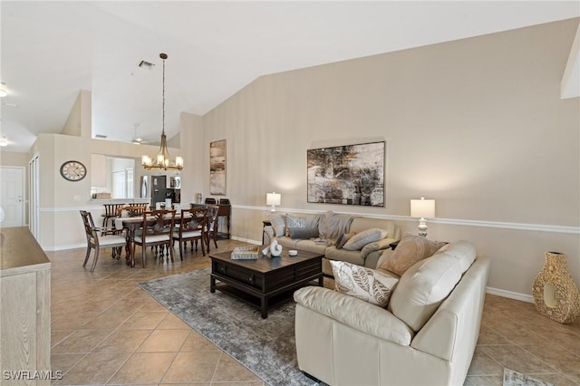 living area with high vaulted ceiling, visible vents, an inviting chandelier, and light tile patterned floors