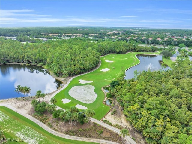 bird's eye view with view of golf course, a forest view, and a water view