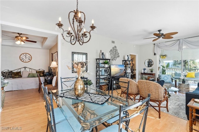 dining room with light wood-style flooring and ceiling fan