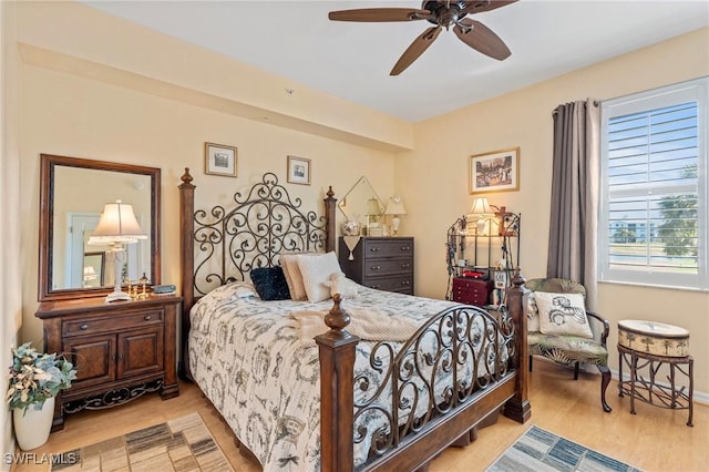 bedroom featuring wood finished floors and a ceiling fan