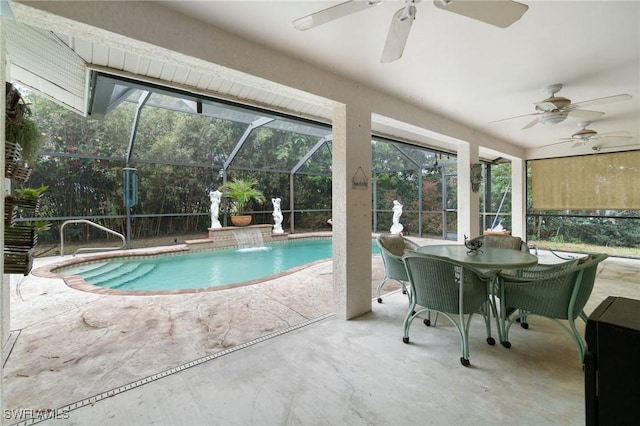 outdoor pool with ceiling fan, glass enclosure, and a patio area