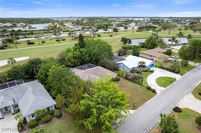 aerial view featuring view of golf course, a water view, and a residential view