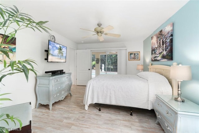 bedroom featuring light wood-style floors, a ceiling fan, and access to exterior