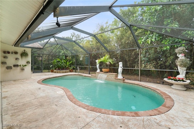 outdoor pool with a patio area