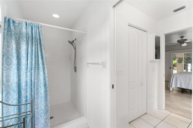 full bathroom featuring visible vents, ensuite bathroom, a ceiling fan, tiled shower, and tile patterned floors