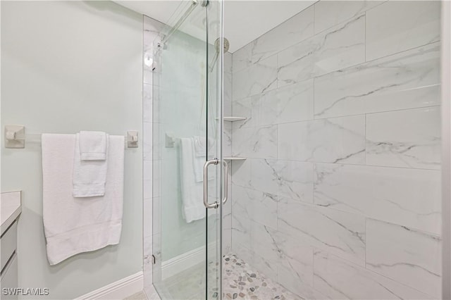 full bathroom with a shower stall and vanity