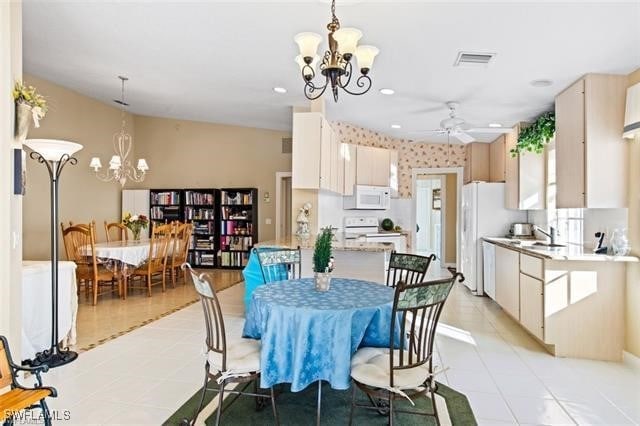 dining room with ceiling fan with notable chandelier, light tile patterned floors, visible vents, and recessed lighting