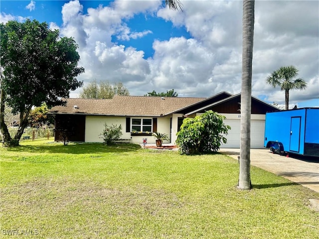 ranch-style home with a garage, driveway, a front yard, and stucco siding