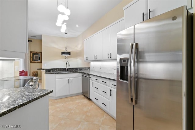 kitchen with white cabinetry, appliances with stainless steel finishes, and a sink