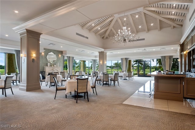 interior space with plenty of natural light, decorative columns, and a high ceiling