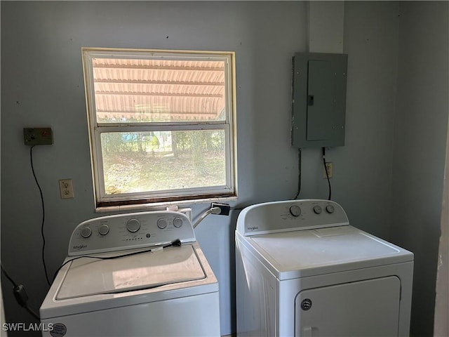 washroom with washer and dryer, laundry area, and electric panel