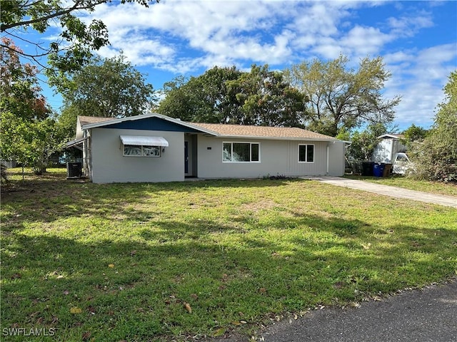 single story home with a front lawn