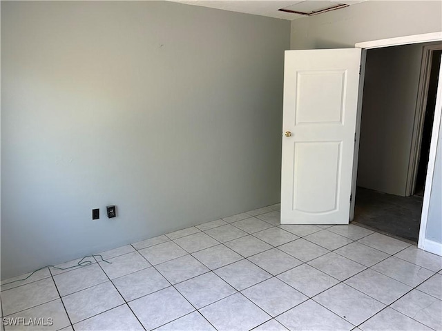 empty room with light tile patterned floors