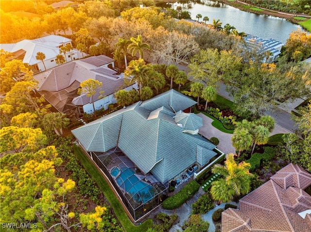 birds eye view of property with a water view