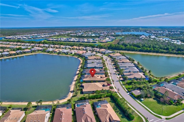 bird's eye view with a residential view and a water view