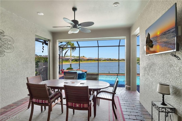 sunroom with a ceiling fan