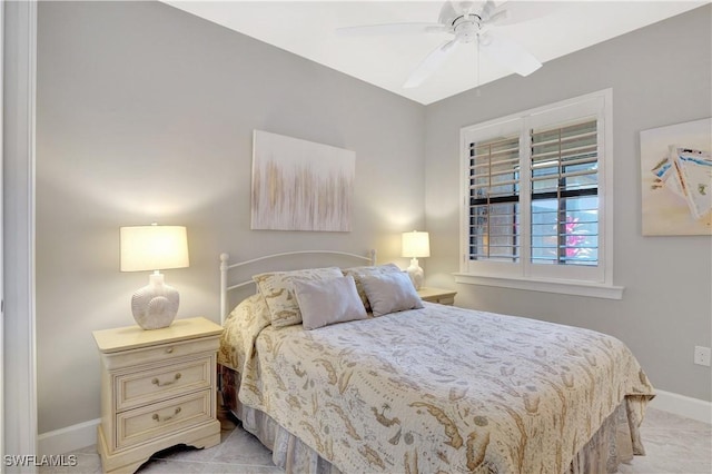 bedroom featuring baseboards and a ceiling fan