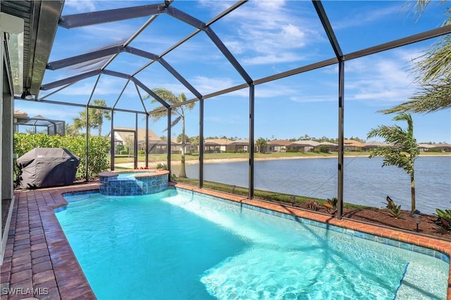 view of pool featuring a patio, a water view, a lanai, and a pool with connected hot tub