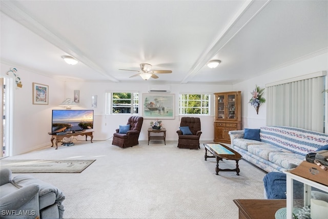 carpeted living room featuring baseboards, a wall unit AC, ceiling fan, crown molding, and beam ceiling