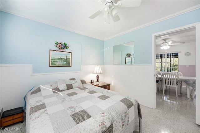 bedroom with a ceiling fan, crown molding, and speckled floor