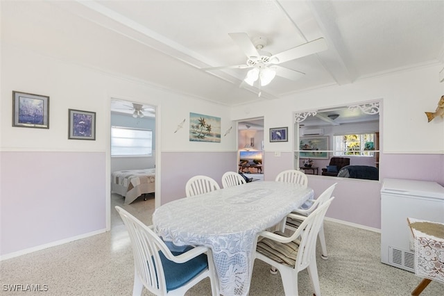 dining room featuring ceiling fan, beamed ceiling, a wealth of natural light, and speckled floor